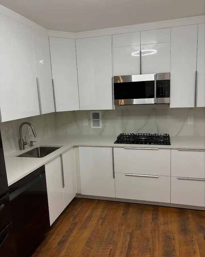 Restored kitchen with white cabinets after water damage in Mercedes